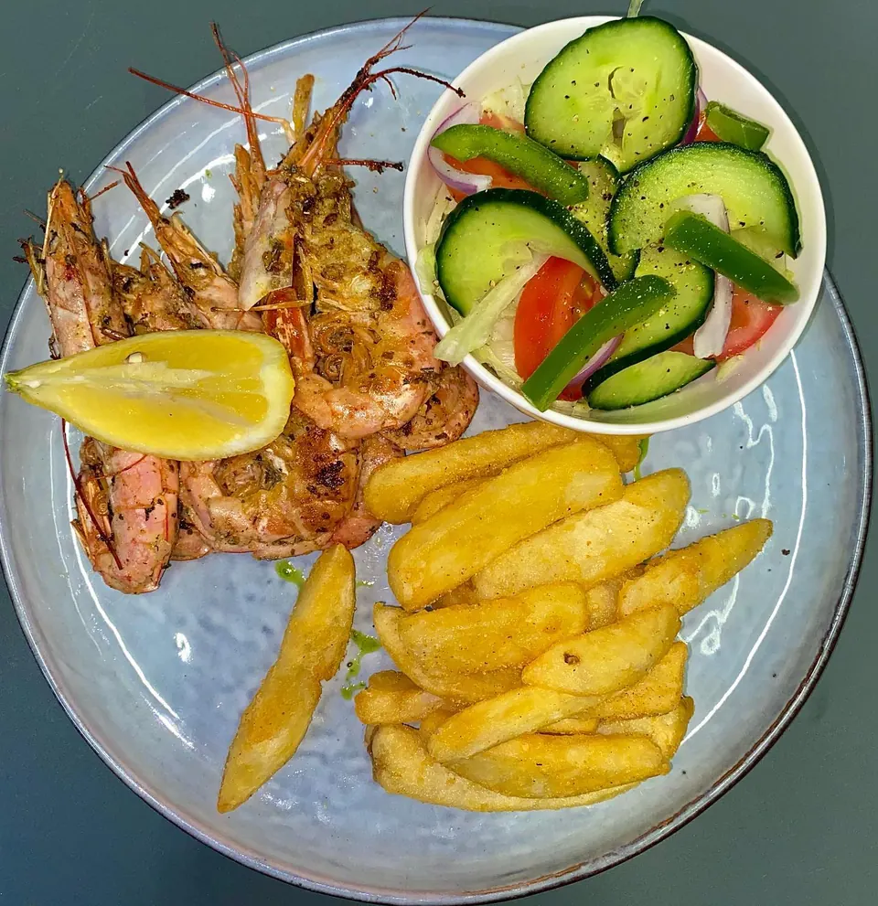 Wood grilled prawns with hand cut chips and a side salad